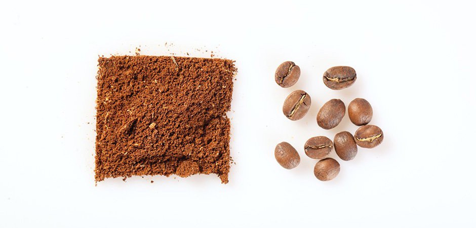 Image of coffee gorunds on the left, next to whole beans on the right.