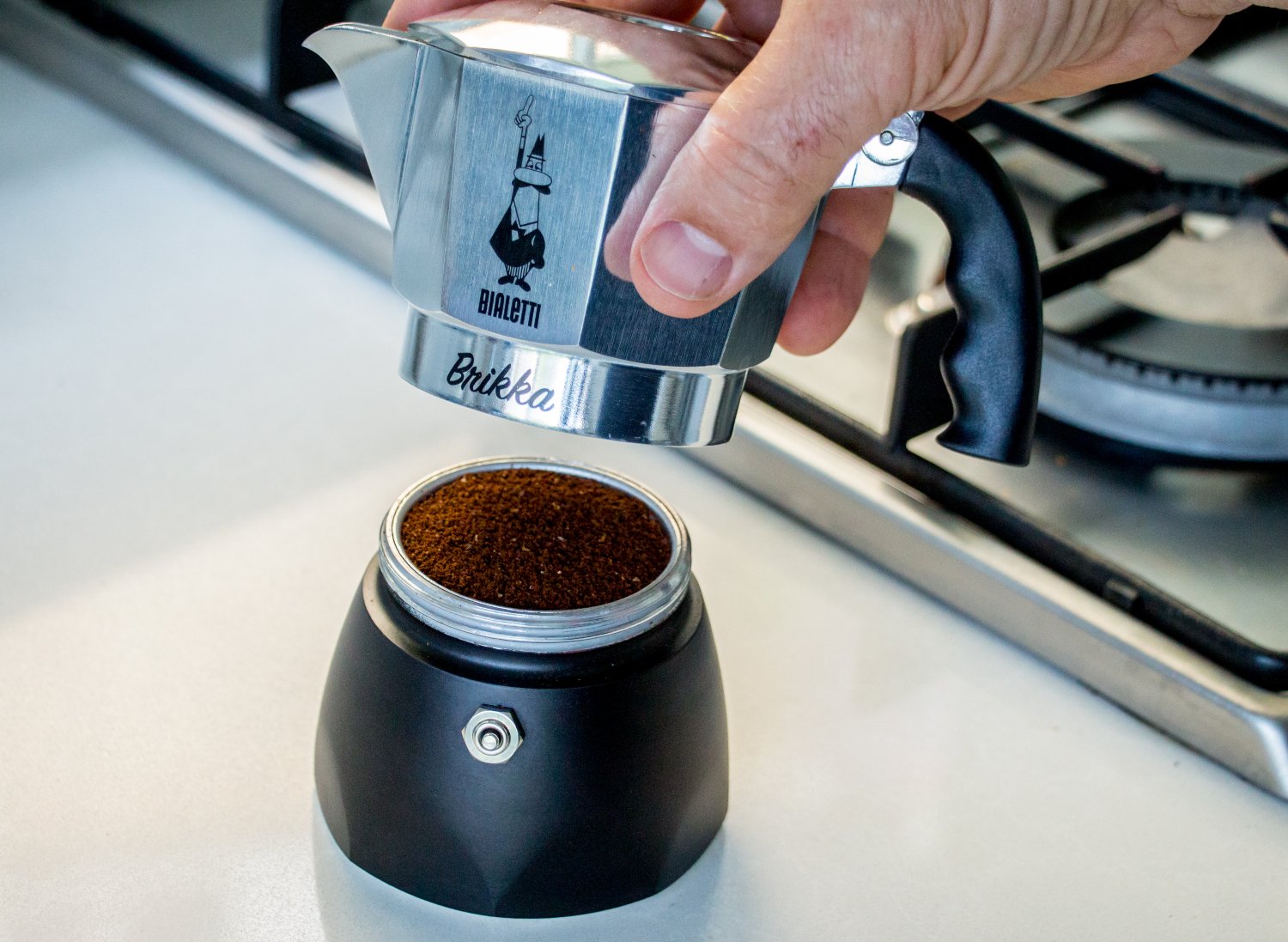 The Bialetti Brikka coffee maker being assembled, put together.